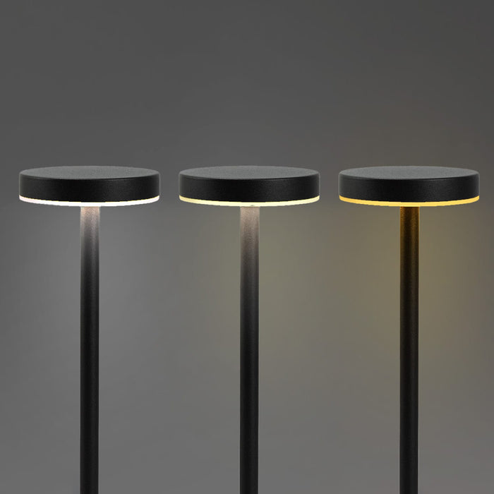 Nouveau Rechargeable Table Lamp - Three black rechargeable table lamps with round tops and adjustable light settings against a grey background.
