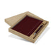 Omega Fashion Notebook and Pen Gift Set - A maroon notebook and pen gift set displayed in a cardboard box. The set features a sleek pen alongside the notebook.