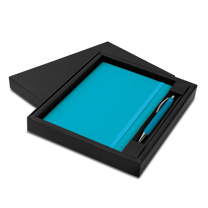 Omega Notebook and Pen Gift Set - A teal notebook and pen set displayed in a black gift box, featuring a simple design and a logo.
