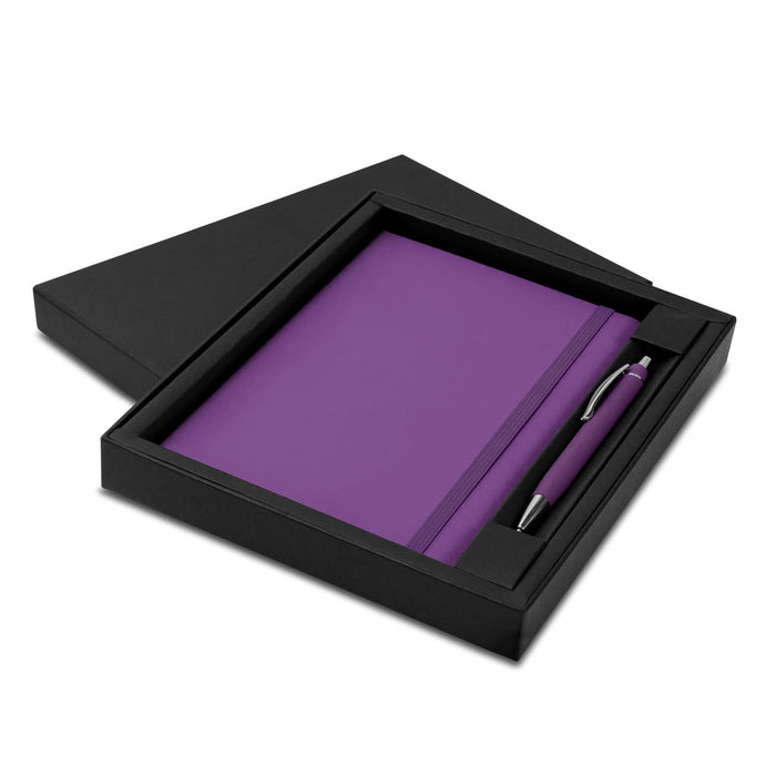 Omega Notebook and Pen Gift Set - A purple notebook and pen set displayed in a black gift box, featuring a logo on the pen.
