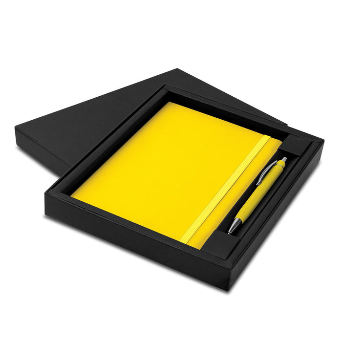 Omega Notebook and Pen Gift Set - A yellow notebook and pen set presented in a black gift box. The set includes a matching yellow pen.