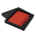 Omega Notebook and Pen Gift Set - A red notebook and pen set presented in a black gift box, featuring a logo on the pen.