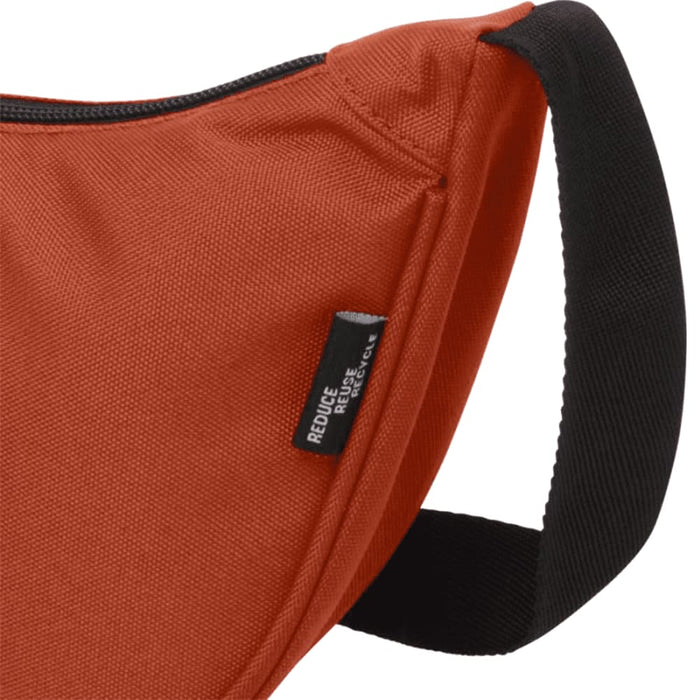 Byron Recycled Waist Bag 1.5L - An orange waist bag with a black strap and a branding label on the side.