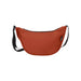 Byron Recycled Waist Bag 1.5L - A burnt orange recycled waist bag with a black zip and strap, featuring a branding logo.
