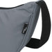 Byron Recycled Waist Bag 1.5L - A grey waist bag with a black strap and a logo tag, featuring a sleek design for casual use.