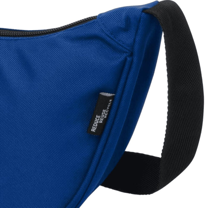 Byron Recycled Waist Bag 1.5L - A blue recycled waist bag with a black strap and a small tag featuring a logo.
