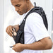 Varyon GRS Recycled Running Vest Hydration Pack 5L - A black recycled running vest hydration pack being worn by a man, featuring mesh pockets for storage.