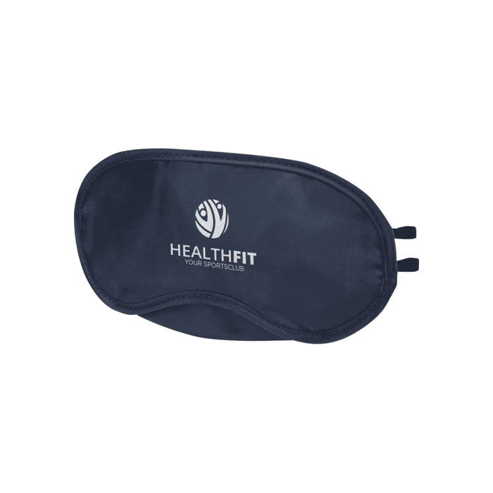 Traveler Eye Mask - A navy eye mask with an elastic band and a logo featuring a circular design.