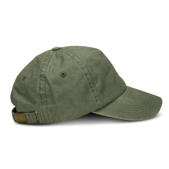 Vintage Washed Cap - A vintage washed cap in olive green with a curved brim and an adjustable strap at the back.