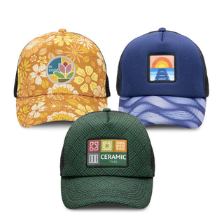 Cruise Custom Cap with Full Colour Patch - A collection of three custom caps featuring floral, sunset, and geometric patterns in orange, blue, and green.