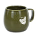 Keepsake Moda Coffee Mug – Set of 2 - A green ceramic coffee mug with a rounded shape and a handle, featuring a simple heart design and a logo.