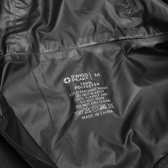 Swiss Peak Urban Unisex Windbreaker - A black windbreaker made of 100% polyester, featuring care instructions and a logo.