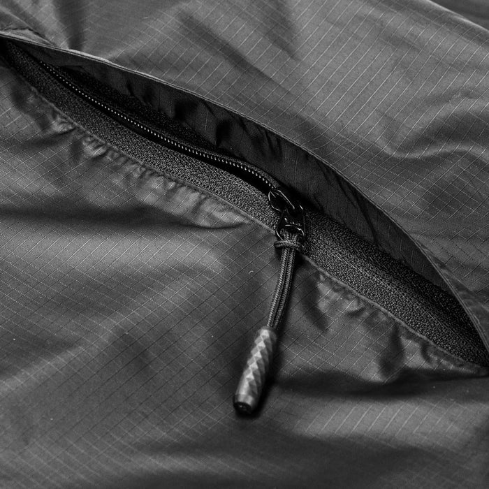 Swiss Peak Urban Unisex Windbreaker - A close-up of a black windbreaker featuring a zipper, with a textured fabric design and a branding logo.