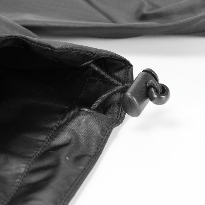 Swiss Peak Urban Unisex Windbreaker - A close-up of a black windbreaker featuring an adjustable drawstring toggle.