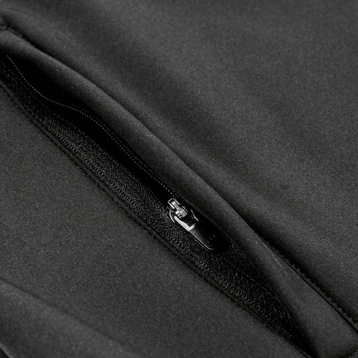 Swiss Peak Urban Unisex Softshell Jacket - A close-up of a black softshell jacket featuring a zippered pocket and sleek fabric texture.
