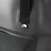 Frontier Bucket Bag - A black bucket bag with a strap and a branded logo on the front. Features a smooth, matte texture.