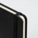 A4 Daily Diary - 2027 - A4 daily diary in black with an elastic band closure and rounded corners. Features a textured cover and plain pages.