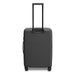 Kadi Check-In Suitcase - Medium - A medium-sized suitcase in matte black, featuring a retractable handle and wheels for easy mobility.