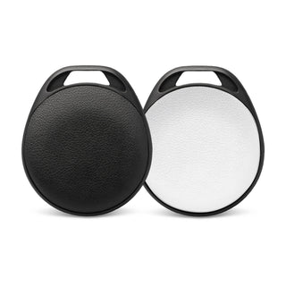 HangFindy Bluetooth Tracker - A pair of round Bluetooth trackers in black and white, featuring a textured surface and a hole for attachment.