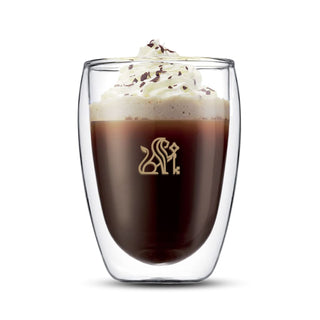 Bodum Pavina Double Wall Glasses - Medium - Set of 2 - A double wall glass with a beverage topped with whipped cream and chocolate shavings, featuring a logo.