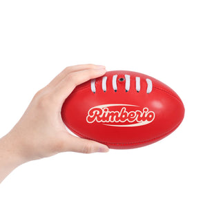 Mini Promotional Aussie Rules Ball - A red mini Australian Rules ball being held in a hand, featuring a logo on its surface.