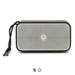 Swiss Peak 10W Bass Speaker - A rectangular grey and silver 10W bass speaker with a textured surface and a detachable strap. It features a logo.