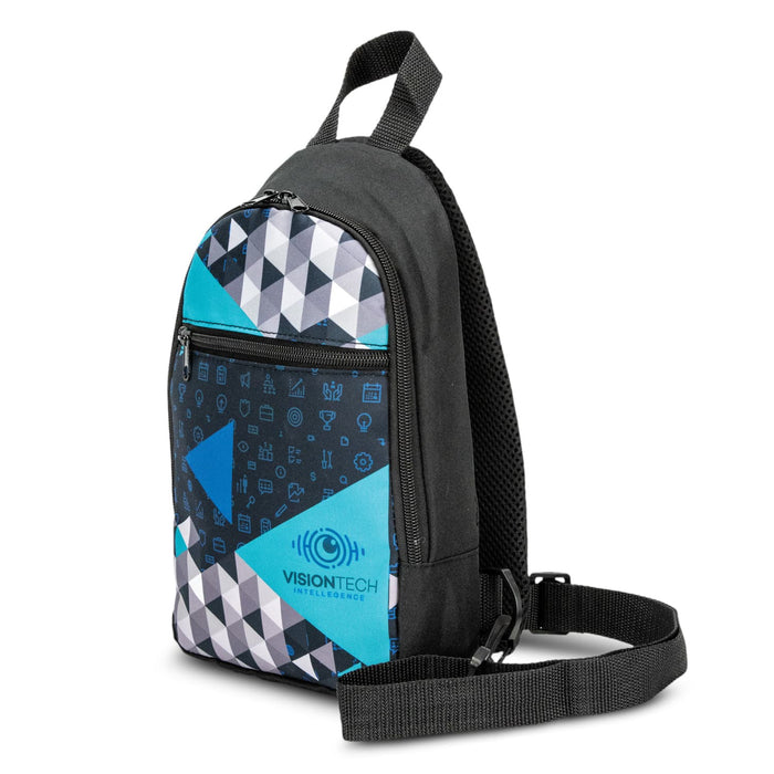 Callum Crossbody Bag - A crossbody bag in black with a blue and grey geometric pattern, featuring a logo on the front.