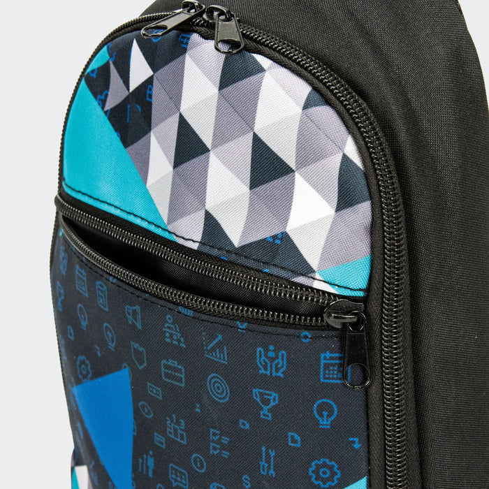 Callum Crossbody Bag - A crossbody bag featuring a geometric pattern in black, turquoise, and grey with zippered compartments and a logo.