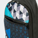 Callum Crossbody Bag - A crossbody bag featuring a geometric pattern in black, turquoise, and grey with zippered compartments and a logo.