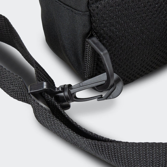 Callum Crossbody Bag - A black crossbody bag featuring a mesh panel and a secure clip on the strap. It has a simple, functional design.