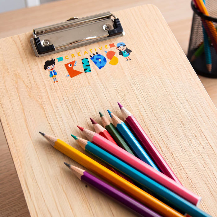 Prism Print - 90 x 25mm Sticker - A wooden clipboard with a colourful logo and a set of vibrant coloured pencils arranged beside it.