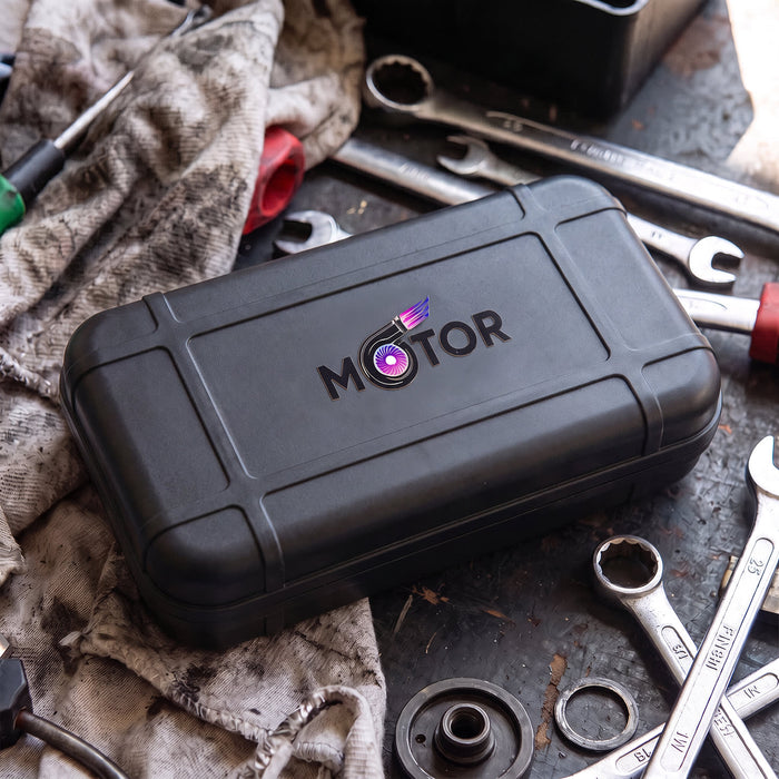 Prism Print - 55 x 24mm Sticker - A black tool case with a logo, resting on a work surface surrounded by wrenches and a dirty cloth.
