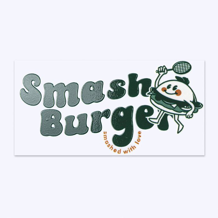 Prism Print - 100 x 50mm Sticker - A rectangular sticker featuring playful illustration of a burger character in green and white, with a logo for "Smash Burger."