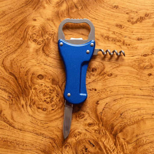 Multi-Tool Bottle Opener - A drink bottle opener in blue, featuring a knife, corkscrew, and a bottle opener, set on a wooden background.