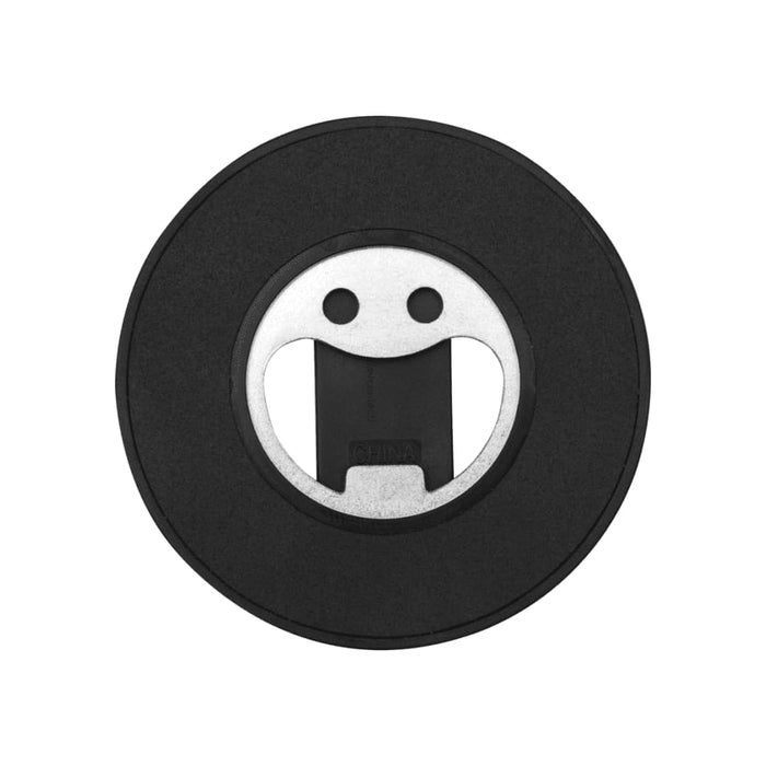 Ain Recycled Plastic Magnetic Phone Stand with Bottle Opener - A black magnetic phone stand with a silver bottle opener, featuring a rounded design and a smiling face.