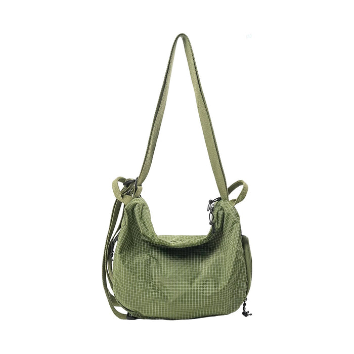 Convertible Lightweight Backpack Duffel Bag - A green convertible backpack duffel bag with a textured pattern and adjustable strap. It features a logo.