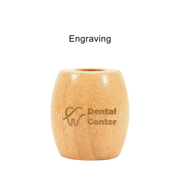 Bamboo Toothbrush Stand - A bamboo toothbrush stand in a light wood finish with a circular opening at the top and a branding logo.