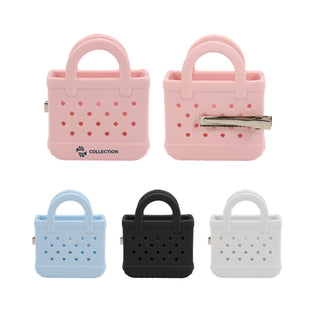 Mini EVA Holes Bag Clip - A pink, blue, black, and grey mini EVA bag clip with holes, featuring a handle and a metallic clip.