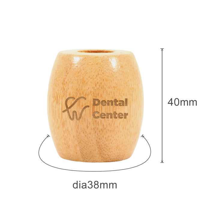 Bamboo Toothbrush Stand - A bamboo toothbrush stand with a natural finish, featuring a logo, measuring 40mm tall and 38mm in diameter.