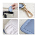 Mini PU Leather Jewellery Box - A small light blue PU leather jewellery box with a clip, showcasing its interior and stitching details.