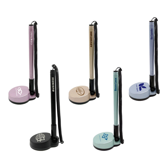 Counter Fixed Signature Pen D - A set of five fixed signature pens on stands, featuring pastel colours like pink, beige, and blue, with various branding.