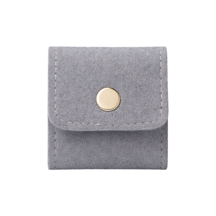 Mini Synthetic Leather Jewellery Bag - A grey synthetic leather jewellery bag with a gold button closure and stitched detailing.