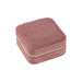 Velvet Jewellery Organizer - A square, soft, pink velvet jewellery organiser with a zip closure. It has a smooth, textured surface.