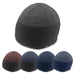Ridge Beanie - A collection of beanies in various colours including black, navy, and striped patterns, with a logo on each.