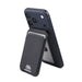 Magnetic Wallet w/ Phone Stand - A magnetic wallet in black, attached to a navy phone, featuring a phone stand and storage for cards.