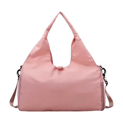 Duffle Bag With Yoga Mat Strap - A pink duffle bag featuring a yoga mat strap and a shoulder sling. It has a simple, modern design.