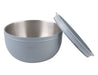 Oasis 2.8L Double Wall Salad Bowl - A double wall salad bowl in light blue with a stainless steel interior and a matching lid. Features a logo.