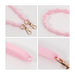 Silicone Flower Tumbler Strap - A drink bottle strap featuring a pink silicone design with flower details and gold clasps for attachment.