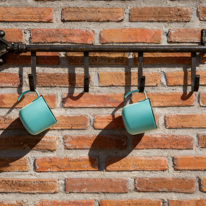 350ML Camping Stainless Steel Insulated Mug - A drink bottle with an insulated design, featuring a light turquoise colour and a hanging loop, displayed on a brick wall.