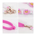 Woven Flower Tumbler Strap - A drink bottle strap in pink and white, featuring woven detailing and metal clips for attachment.